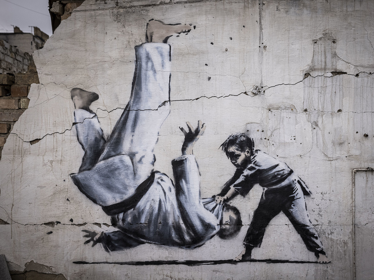 Banksy Eerbetoon Judo Kind wallpaper mural